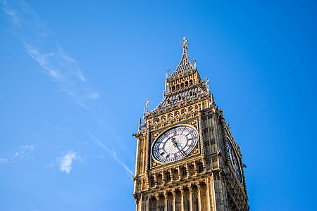 Low Angle View of Clock Tower Against Blue Sky thumbnail