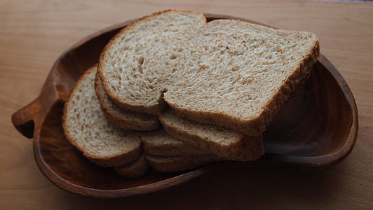 several wheat bread on top of brown saucer thumbnail