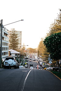 cars passing through grey asphalt road thumbnail