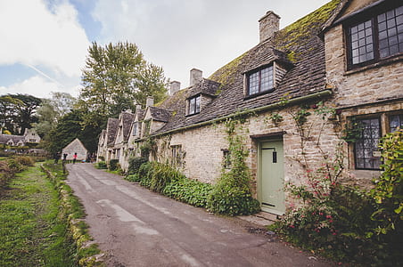 photo of brown and gray concrete 3-storey house thumbnail