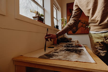 man painting on table thumbnail