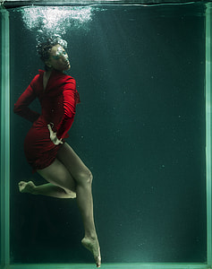 woman wearing red long-sleeved mini dress in water thumbnail
