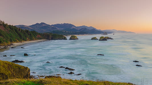 blue sea and brown mountains thumbnail