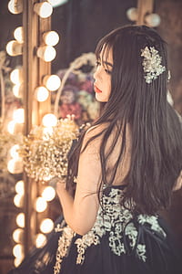 woman in black and white floral dress thumbnail