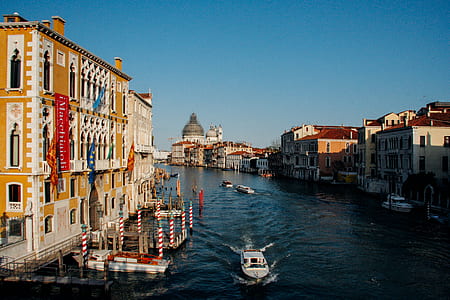 white boat on body of water during daytime thumbnail
