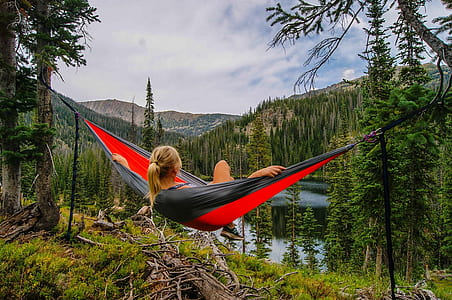 woman in the forest while on hammock thumbnail
