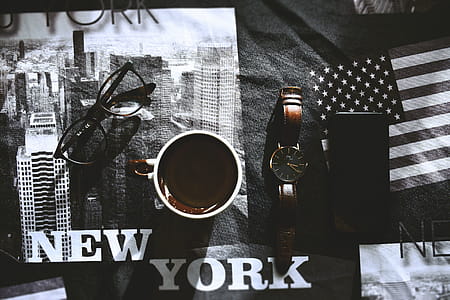White and Brown Mug Beside Brown Watch thumbnail