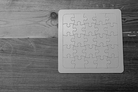 grayscale photography of jigsaw puzzle thumbnail