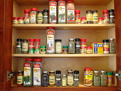 assorted bottle lot on brown wooden cabinet thumbnail