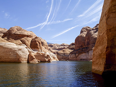 body of water surrounded by rock formation thumbnail