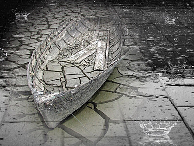 gray clinker boat on concrete pavement thumbnail