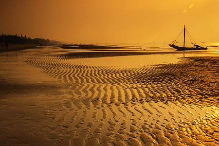 Sea Water With Boat during Sunset thumbnail