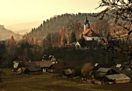 silhouette photo of village houses thumbnail