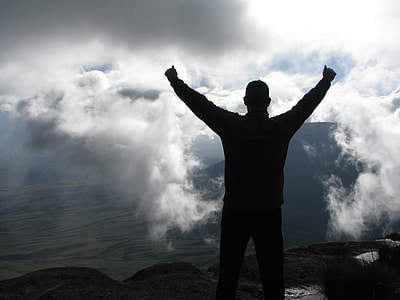 silhouette of man on top of the summit thumbnail