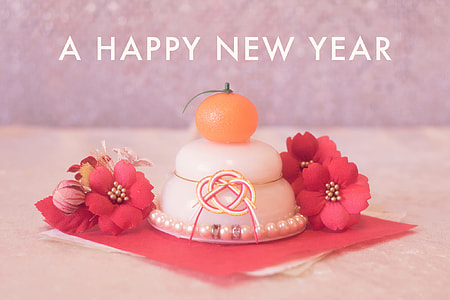 close up photo of white, red, and orange home decors with A Happy New Year text thumbnail