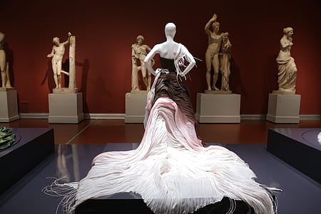 white, pink, and brown dressed statue thumbnail