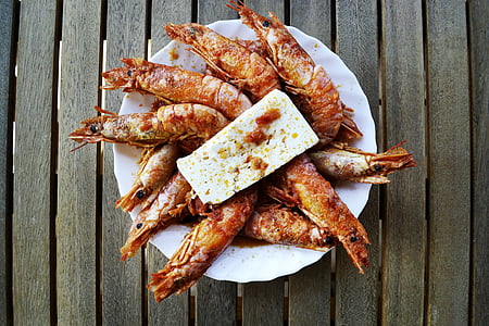 cooked shrimp on top of white plate with cheese on top thumbnail
