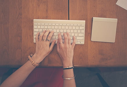 person typing on white computer keyboard thumbnail