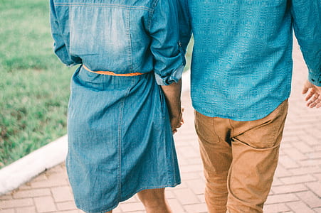 man and woman holding each other's hand thumbnail