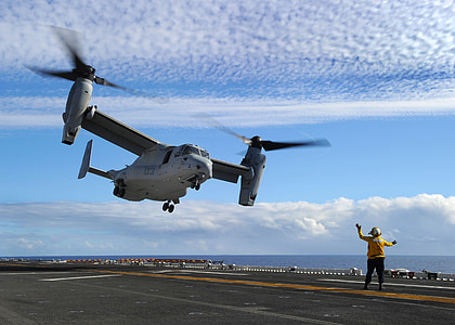 white drone about to land in the carrier thumbnail