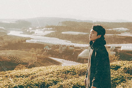Man Standing in Front of Mountain thumbnail