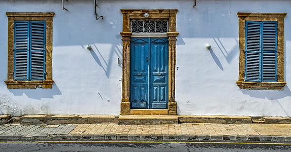 closed blue wooden doors thumbnail
