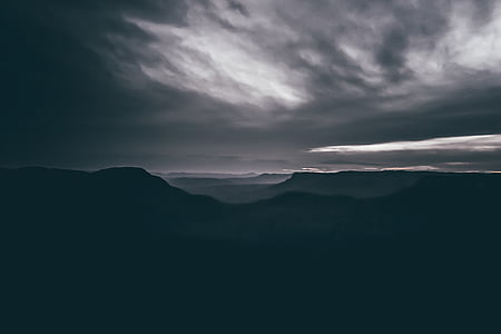 mountains under gray cloudy sky thumbnail