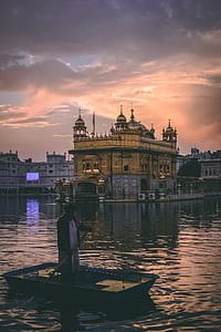 photo of golden temple during sunset thumbnail