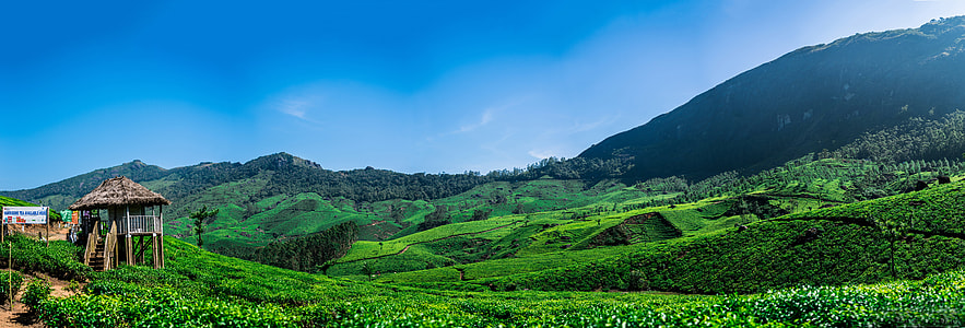 green mountain under blue sky thumbnail
