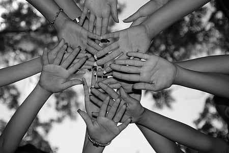 grayscale photography of people's hands thumbnail
