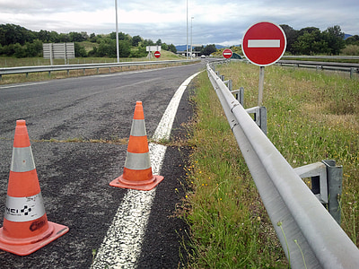 stop signage with traffic cones on highway ] thumbnail