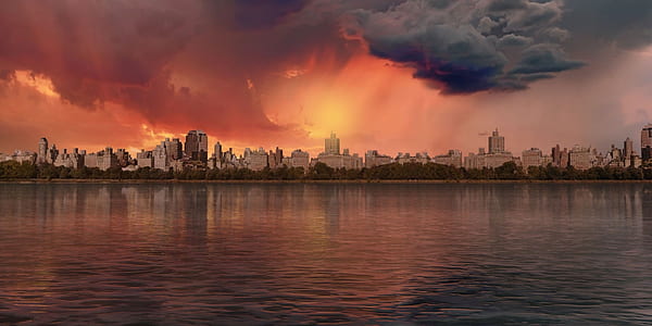 landscape photography of high rise building and body of water thumbnail