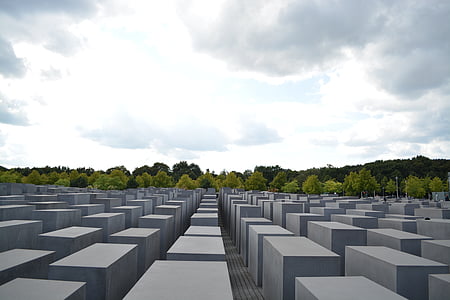 gray concrete block lot under gray clouds thumbnail