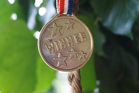 close up focus photography of gold Winner medal thumbnail
