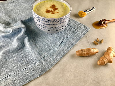 white ceramic bowl with yellow liquid thumbnail