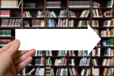 person holding arrow right paper thumbnail