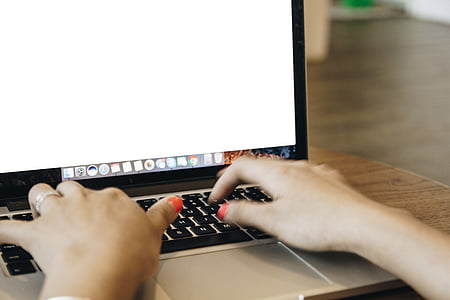 person using MacBook on table thumbnail