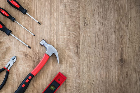 Construction tools on the wooden background. thumbnail