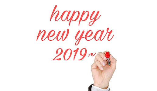 Hand with a marker writing out Happy New Year 2019 thumbnail