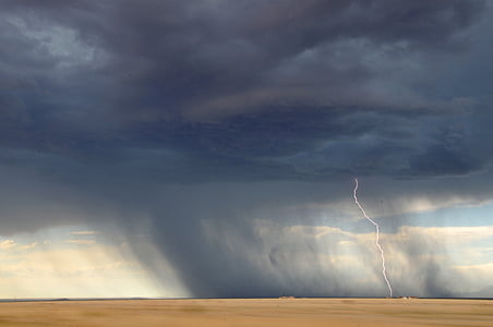 person taking photo of typhoon with lightning thumbnail