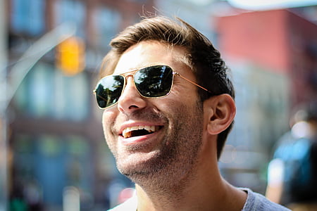 man wearing gold framed sunglasses thumbnail