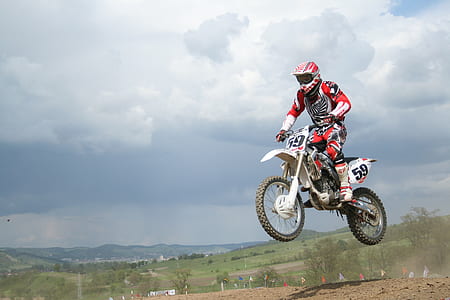 time-lapse photography of person riding motocross dirt bike thumbnail