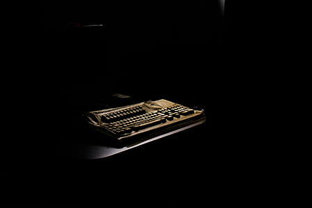 brown electric typewriter keyboard inside dim room thumbnail