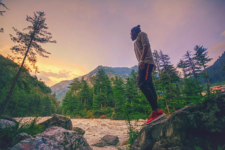 man standing on rock thumbnail