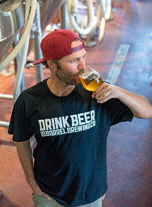 Man Drinking Beer and Looking at His Left Side thumbnail