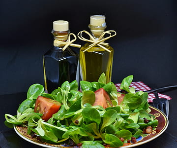 vegetable salad with olive oil bottles thumbnail