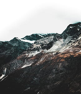 black and white mountains under clear sky thumbnail