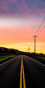 black asphalt road under orange sunset thumbnail