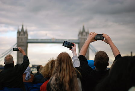People Taking Picture at Tower Bridge Under Gray Clouds thumbnail
