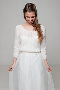 woman wearing white sweater and mesh skirt thumbnail